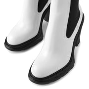 Tread heeled ivory chelsea boots